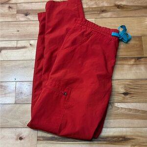 Figs fion Lite size xs petite scrub pants in the color awesome red.